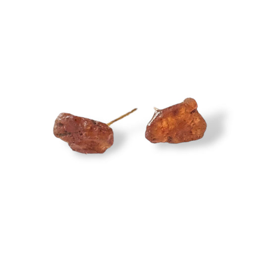Ruby stud earrings displayed on a clean white background