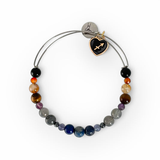 Sagittarius Crystal Charm Bracelet with a black charm, featuring Lapis Lazuli, Carnelian, Citrine, Amethyst, and more for freedom and insight.
