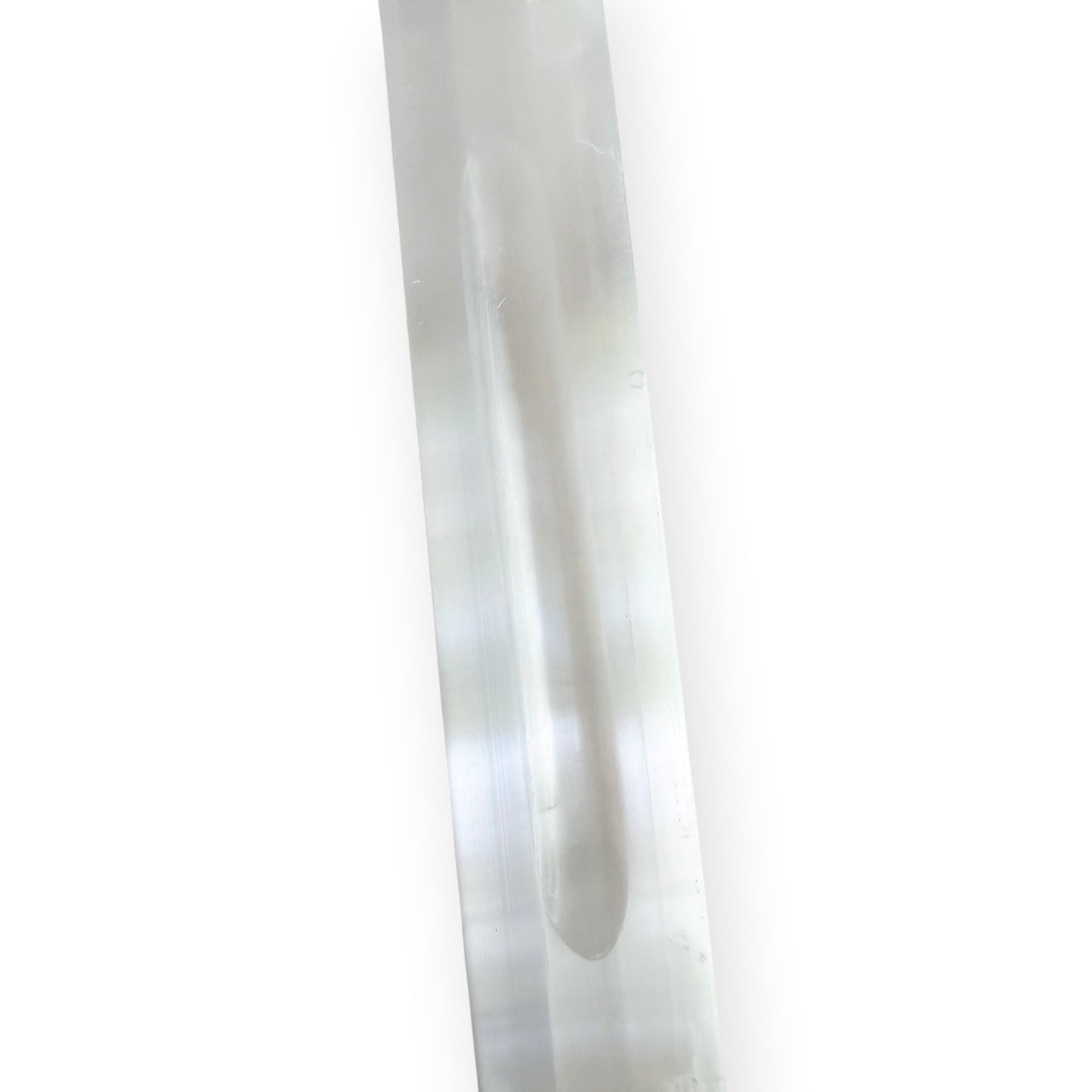 Satin spar selenite crystal charging bar with carved center groove and luminous white finish.