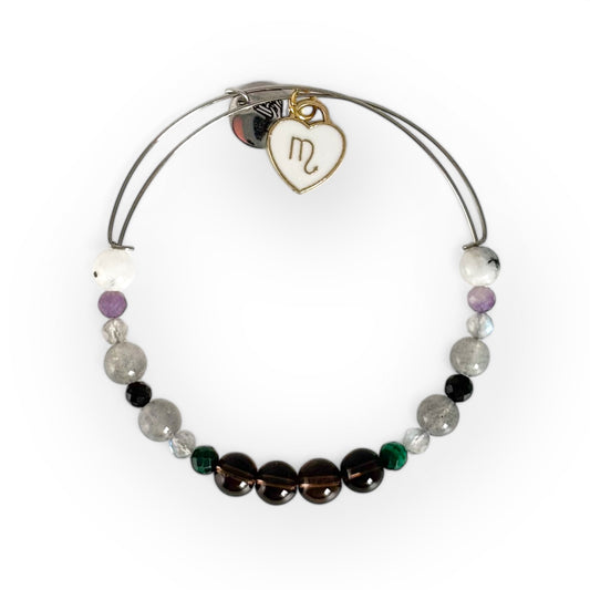 Scorpio Crystal Charm Bracelet with a white charm, handcrafted with Smoky Quartz, Malachite, Hematite, Labradorite, Black Tourmaline, Amethyst, and Moonstone for protection and transformation.