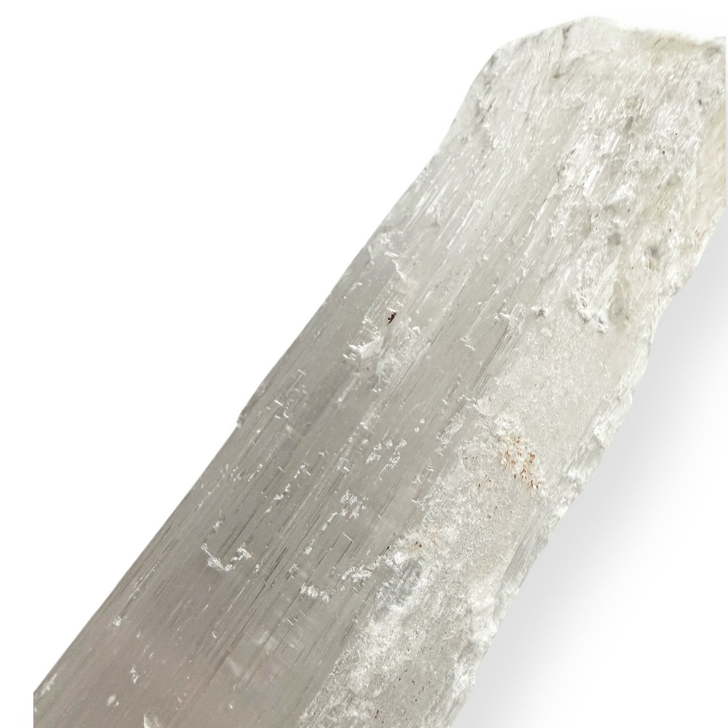 Close-up of a Satin Spar Selenite wand showing natural pearly texture
