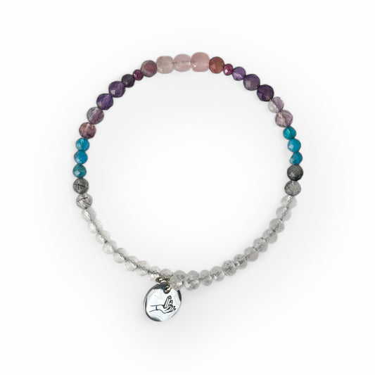 Serenity Crystal Wrap Bracelet worn on wrist with soft pink, purple, and clear beads