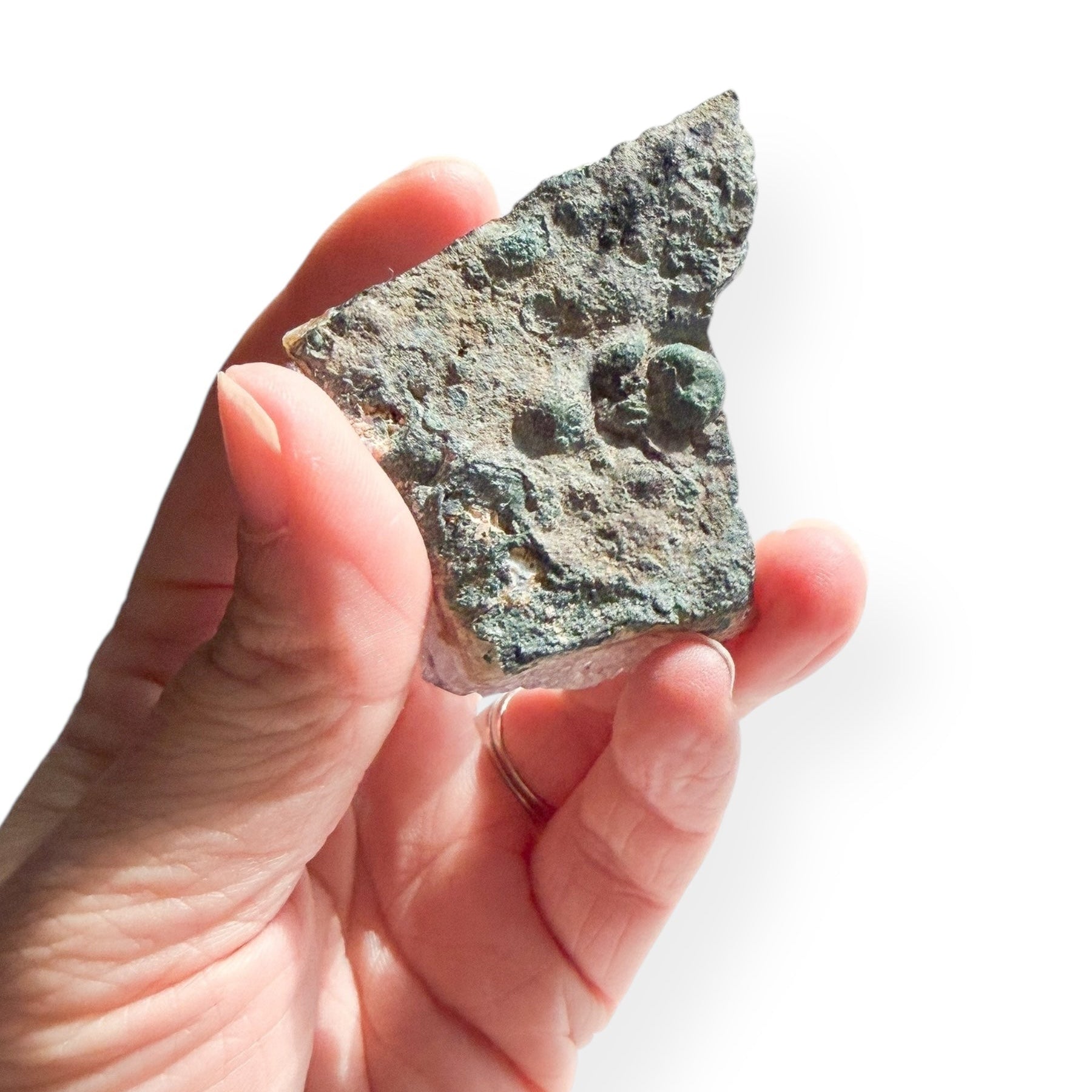 Back view of small amethyst cluster showing natural green mineral base