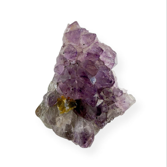 Small amethyst cluster with purple crystal points on natural matrix base