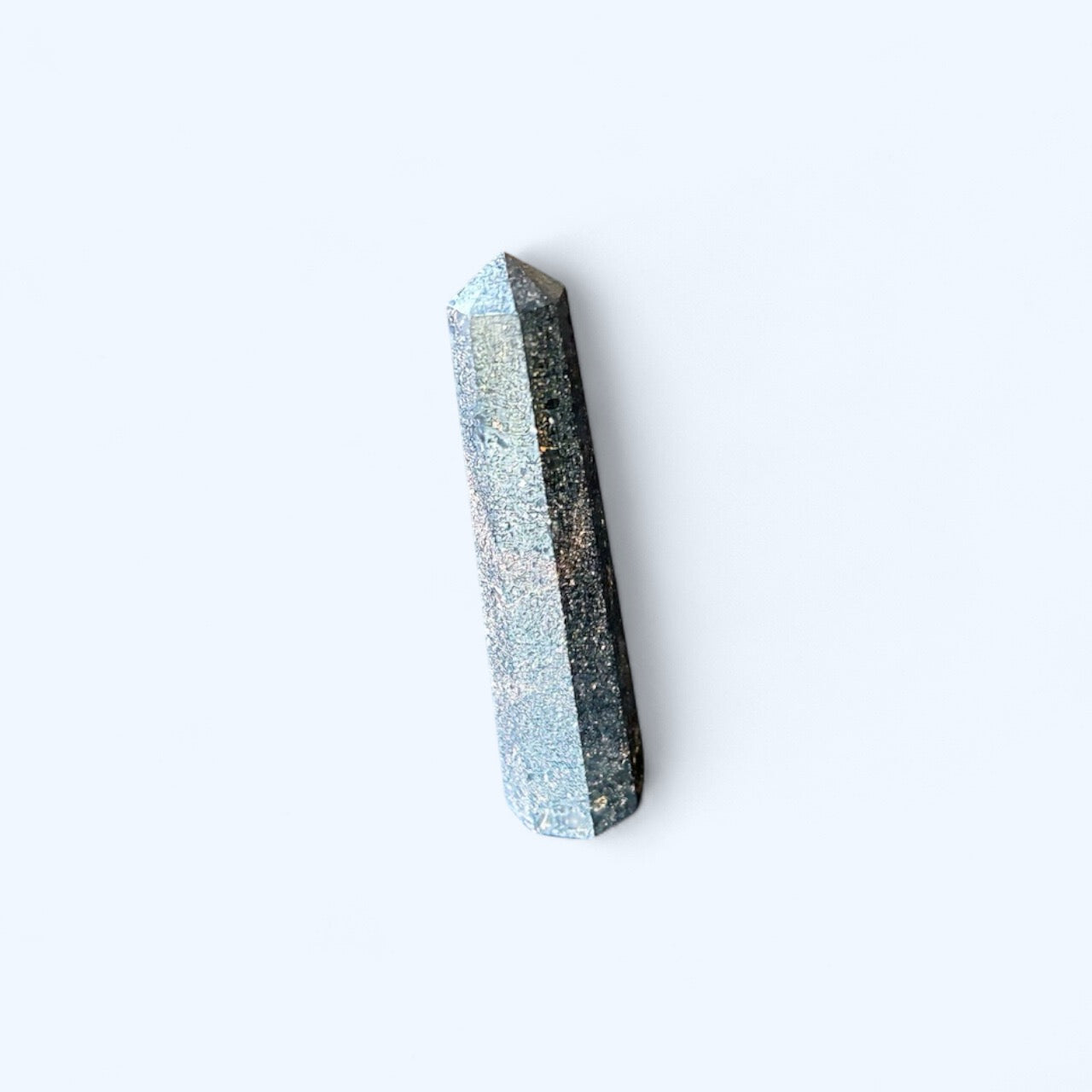 Close-up of Small Pyrite Obelisk highlighting its golden shimmer and crystal structure