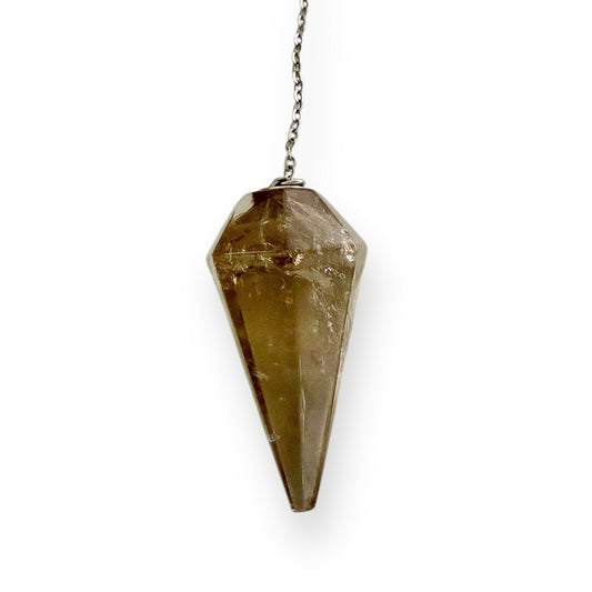 Smoky quartz pendulum used as a divination tool for intuitive guidance and spiritual practice