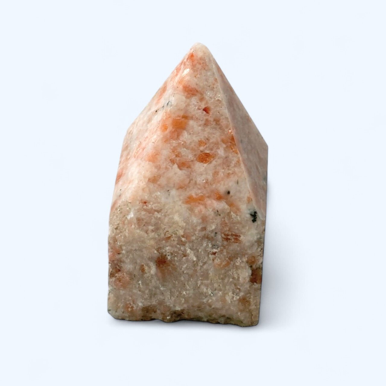 Sunstone crystal point with polished top and rough base in warm peach and orange tones