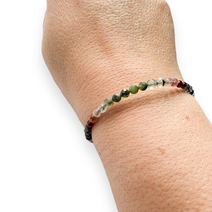 Side angle view of Tenacious Wrap Bracelet with 4mm faceted natural stone beads.