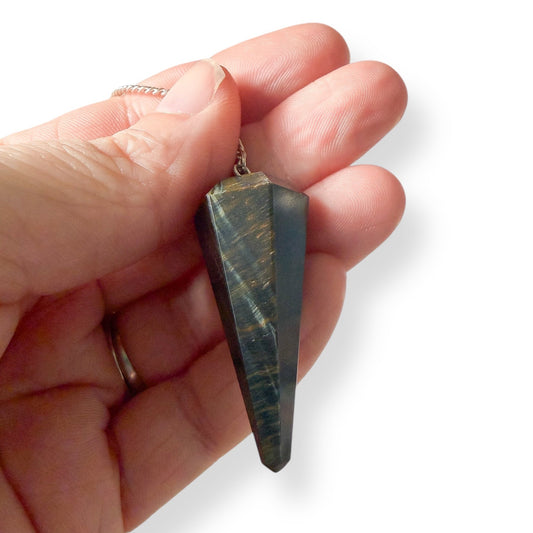 Natural tiger’s eye dowsing pendulum on chain, a grounding spiritual tool