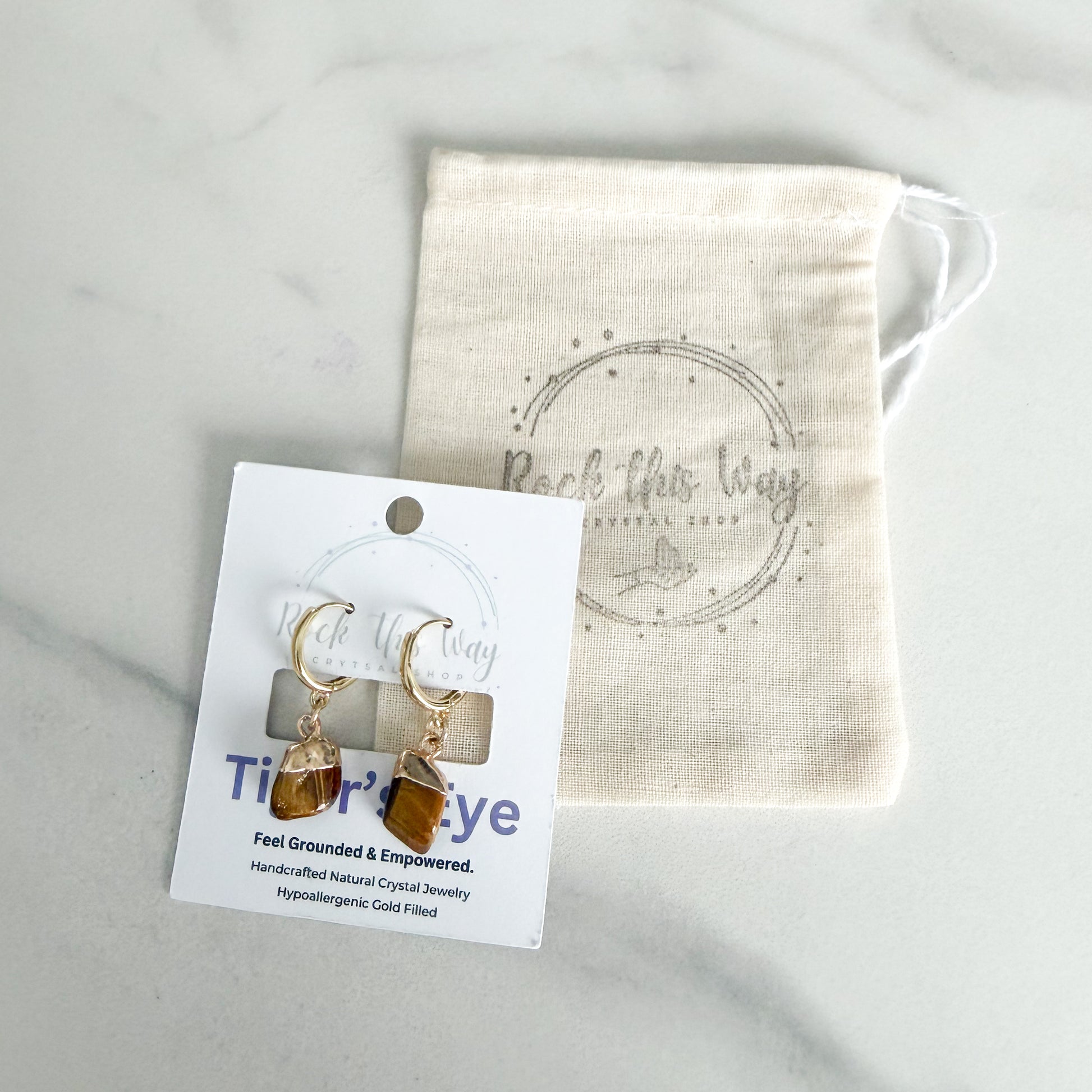 Tiger’s Eye drop huggie earrings packaged on branded jewelry card ready for gifting