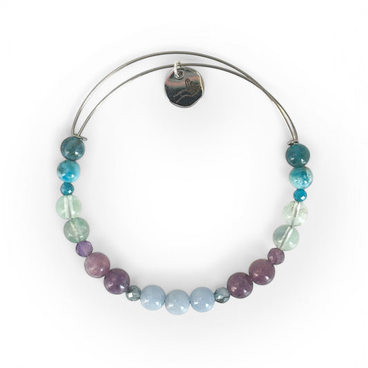 Tranquility Crystal Bracelet with soft-toned gemstones on white background