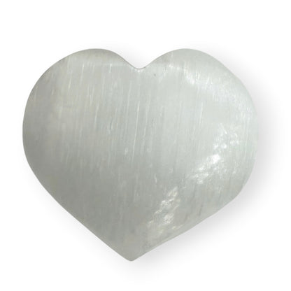 White Satin Spar crystal heart with a smooth polished finish and soft glow.