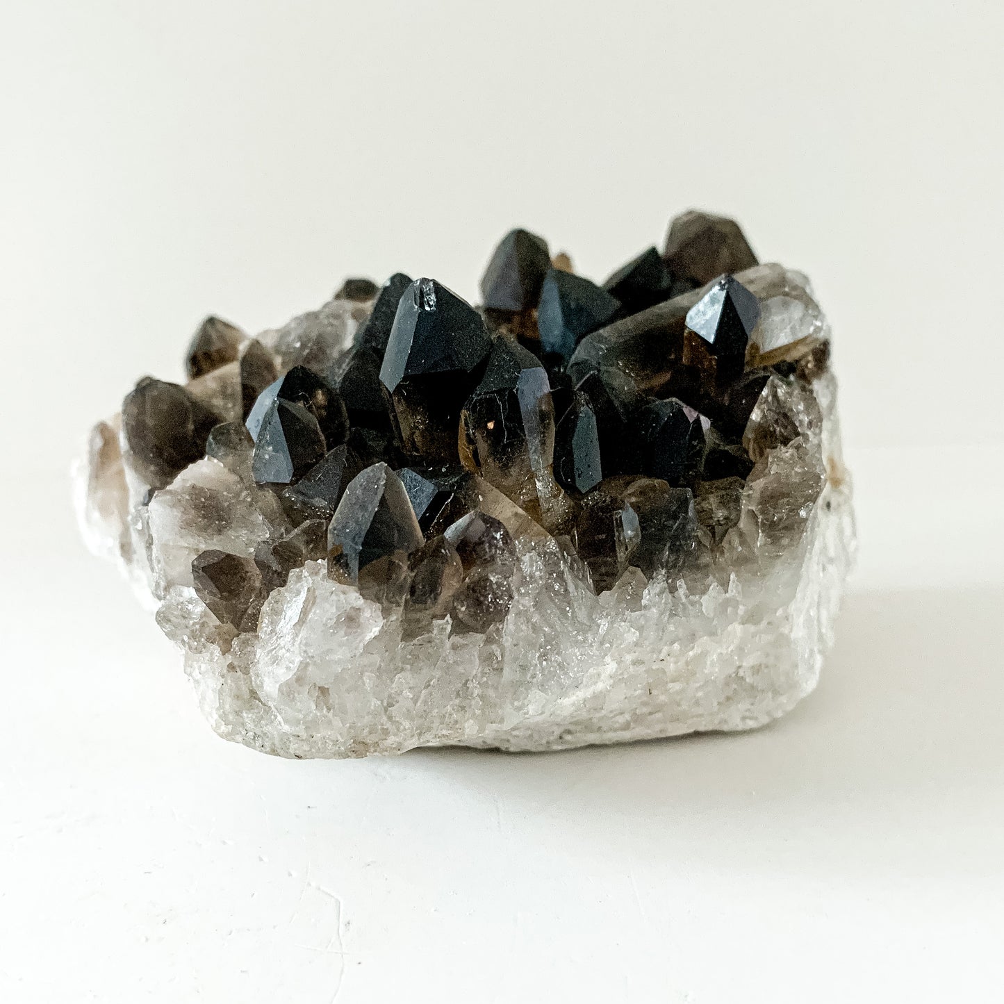 Side angle of Smoky Quartz Cluster with visible matrix and points